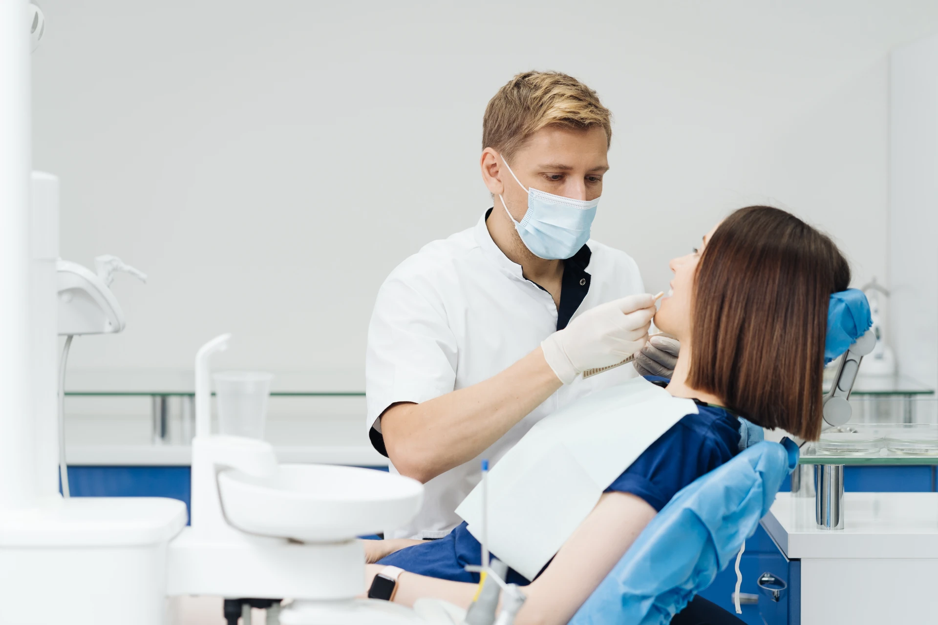 close-up-portrait-beautiful-young-lady-sitting-dental-chair-while-stomatologist close-up-portrait-beautiful-young-lady-sitting-dental-chair-while-stomatologist