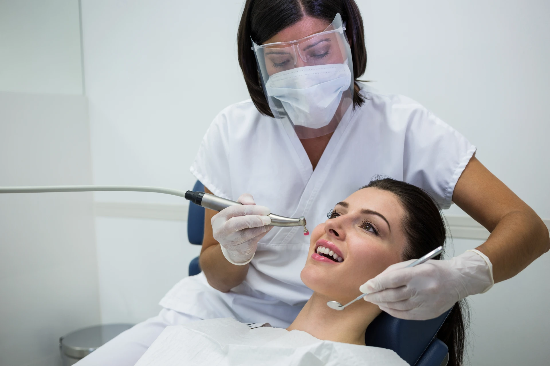 dentist-examining-female-patient dentist-examining-female-patient