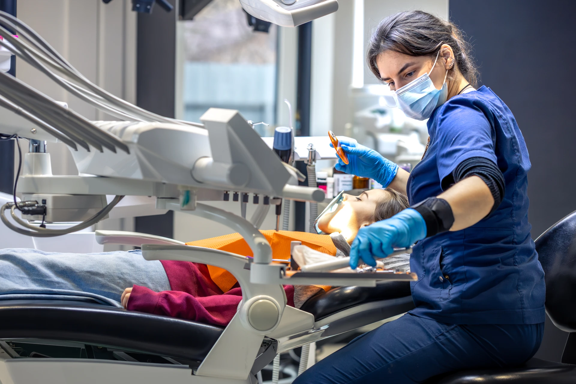 young-female-dentist-dental-office-dentist-work young-female-dentist-dental-office-dentist-work